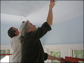 Kim and Pete Work On Ceiling
